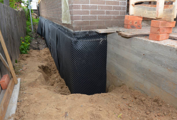 Happy homeowners after waterproofing job in Totowa